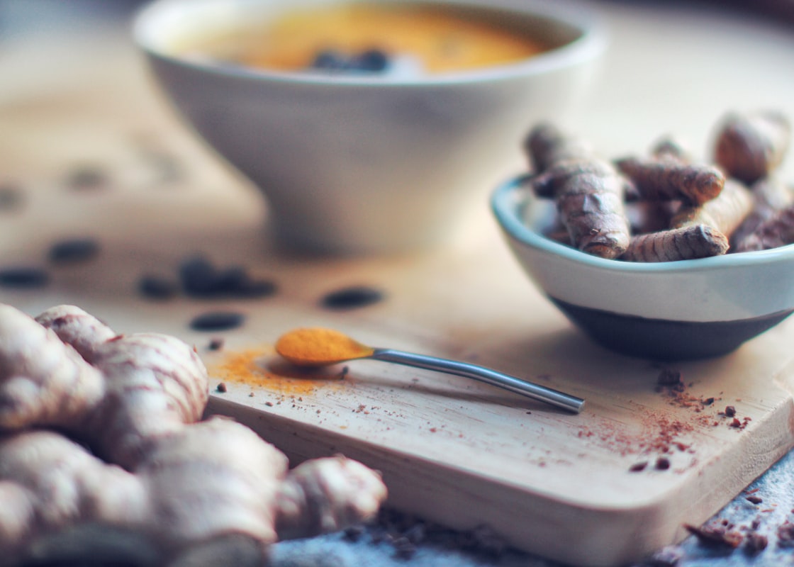 Fresh anti-inflammatory ingredients including colorful vegetables, herbs, and whole grains